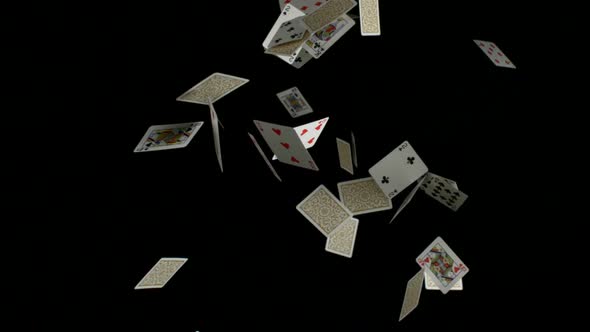 Playing cards falling on black background, Slow Motion