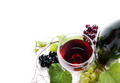 Top view of glass of red wine and bottle with grape vine - PhotoDune Item for Sale