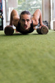vertical portrait of a sportsman doing push-ups - PhotoDune Item for Sale