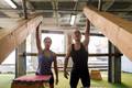 sportswoman and sportsman pose on training machine - PhotoDune Item for Sale