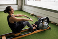 athlete training at gym on a water rowing machine - PhotoDune Item for Sale