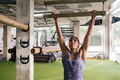 sportswoman strength training doing pullups at gym - PhotoDune Item for Sale