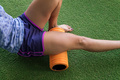 leg of sportswoman in the gym relaxing her muscles - PhotoDune Item for Sale