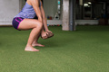 unrecognizable sports woman doing squats - PhotoDune Item for Sale