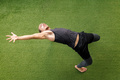 athlete training at gym stretching on the floor - PhotoDune Item for Sale