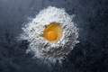 Egg in flour on dark background - PhotoDune Item for Sale