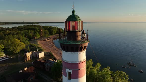 Aerial View of the Closeup Tower Lighthouse at Sunset