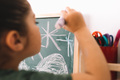 little girl drawing on a chalkboard - PhotoDune Item for Sale