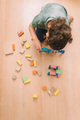 girl playing with building blocks in the floor - PhotoDune Item for Sale