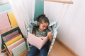 little girl reads relaxed in her room - PhotoDune Item for Sale