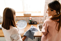 White mother and daughter smiling while washing dishes in kitchen - PhotoDune Item for Sale