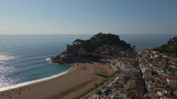 Aerial Footage of a Massive Medieval Fortress on the Shore of Tossa De Mar