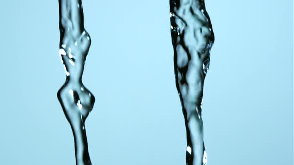 Water pouring and splashing in ultra slow motion 1500fps on a reflective surface - WATER POURS 