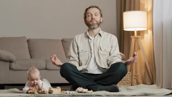 Bearded Father Dad Man Parent Sitting on Floor in Lotus Position Meditating Stress Relief Meditation