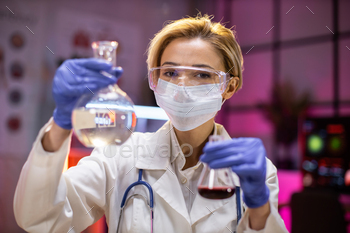 g flask with lab glassware and test tubes in chemical laboratory background, science laboratory research and development medicines.