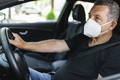 Senior in his 70s driving car wearing a face mask - PhotoDune Item for Sale