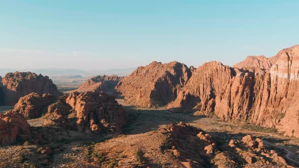 Wide pushing aerial shot of Utah's ancient lava flow rocks.