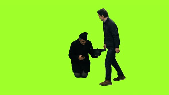 Beggar Holding Hat and Gets a Coin from a Man Walking by, Chroma Key