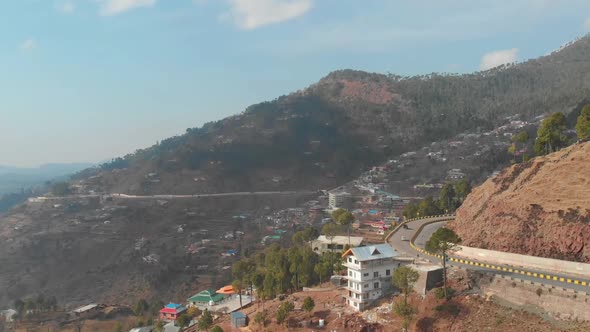 Aerial View Of Winding Road With Traffic Going Past In  Muzaffarabad In Pakistan