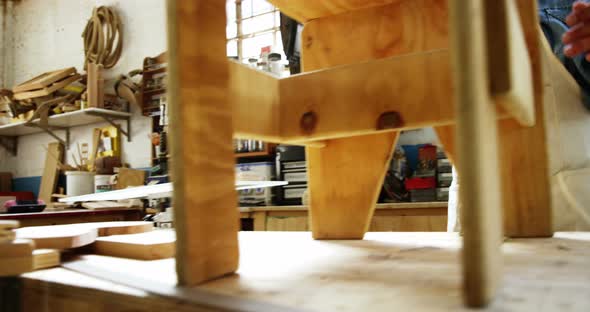 Carpenter making a chair