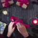 Female hands tying gifts to celebrate New Year - VideoHive Item for Sale