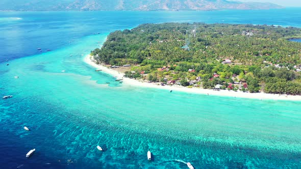 Wide angle aerial abstract view of a paradise sunny white sand beach and aqua blue water background 