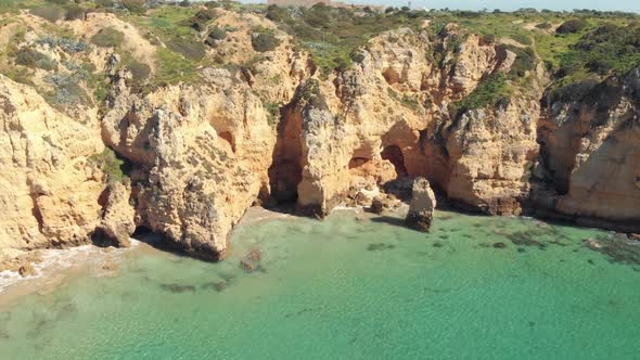 Paradisiacal secluded beaches of Lagos , Algarve. Translucent waters of the Atlantic ocean.