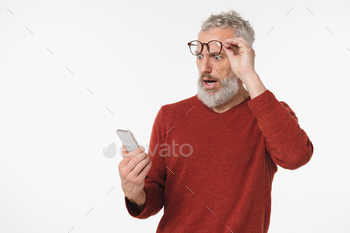 man shocked impressed using smart phone cellphone, winning money, online casino, bets on sport isolated in white background