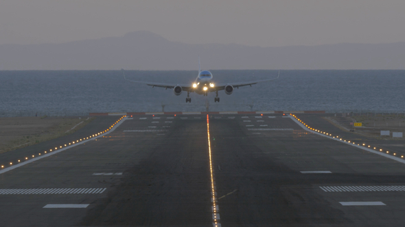 Passenger Airliner Landing at the Airport in Coastal City