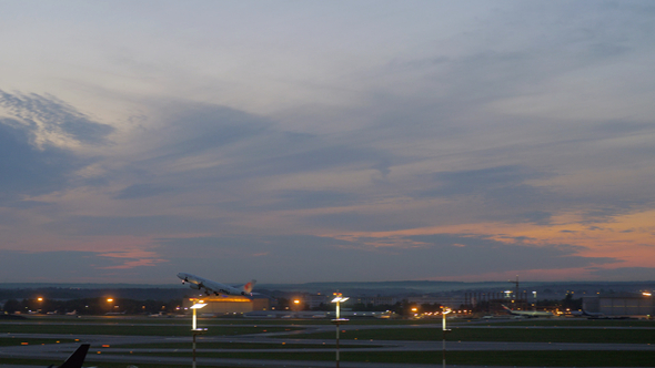 Passenger Airplane Taking Off in the Dusk