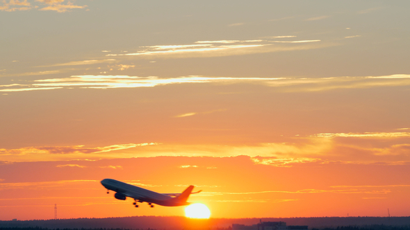 Plane Taking Off at Golden Sunset