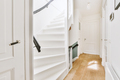 Wooden staircase in spacious hall of apartment - PhotoDune Item for Sale