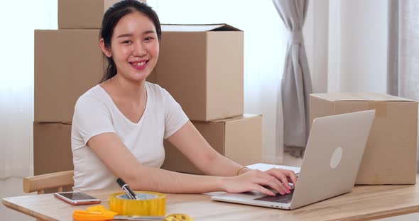 Asian Woman Business Owners Smiling To Camera