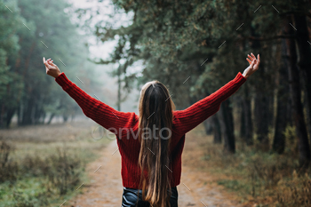 Stress and Anxiety. Nature break relieves stress. Alone Young woman with long fluttering hair express emotions in forest