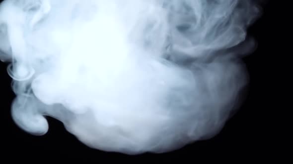 White Smoke Floating Through Space Against Black Background. Mist, Smoke , Vapor, Fog Effect. Slow
