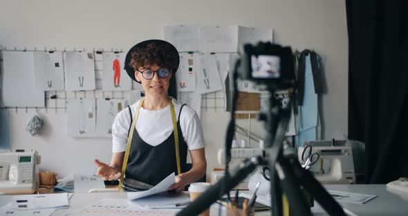 Female Blogger Designer Recording Video for Internet Vlog Showing Sketches