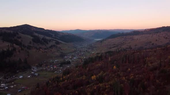 Autumn Sunset Over Ceahlau Village In Romania, Aerial View