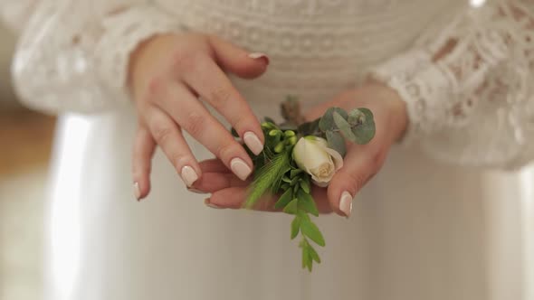 Beautiful, Lovely Bride in Wedding Luxury Dress. Wedding Bouquet in Hands for Groom
