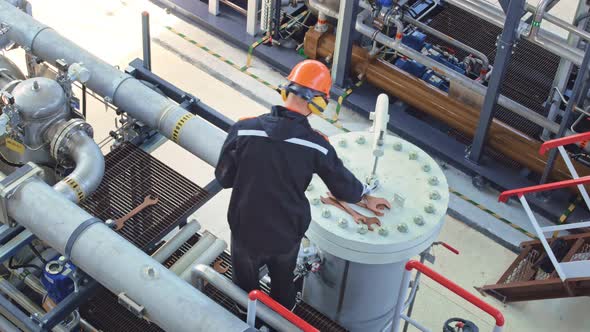 A Mechanic Spreads Out Large Wrenches Preparing to Repair Equipment