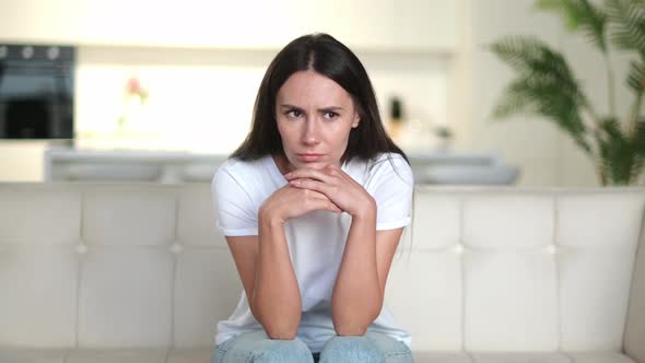 Disappointed Unhappy Caucasian Young Woman Sitting on the Sofa in the Living Room She Has Personal