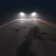 Car with Headlights on Follows Camera Tracking Along Country Night Road - VideoHive Item for Sale
