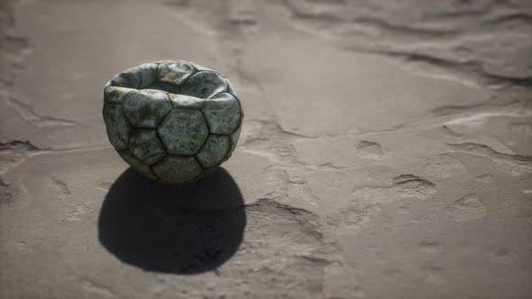 Old Soccer Ball the Cement Floor