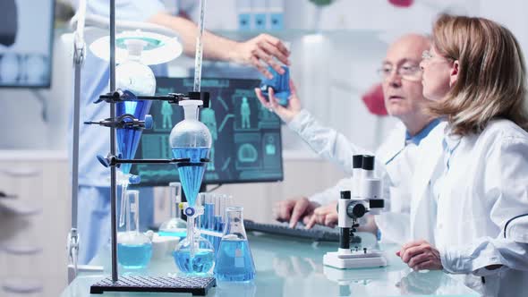 In Modern Research Laboratory Two Scientists Are Debating alt