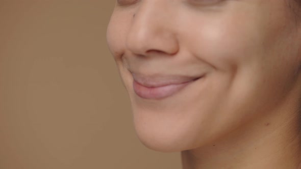 Beautiful Female Lips Smiling Revealing White Teeth