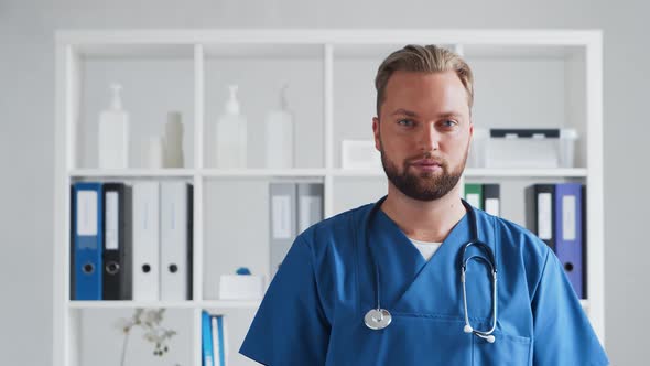 Professional medical doctor in hospital office, Portrait of young and confident physician.