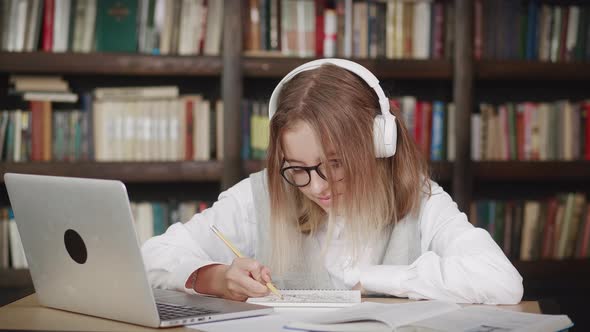 Caucasian Teen Girl Young Woman School Wear Headphones Learn Watching Online Webinar Webcast Class
