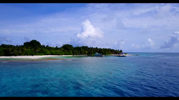 Aerial drone travel of tropical coastline beach holiday by blue sea and white sand background of a d