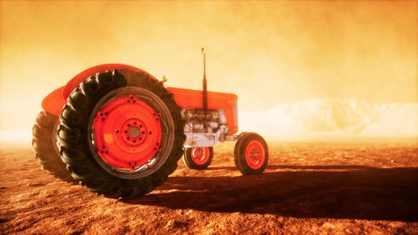 Vintage Retro Tractor on a Farm in Desert