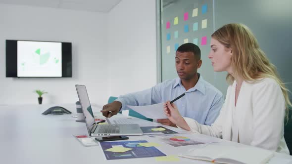 Man and woman discussing at the office