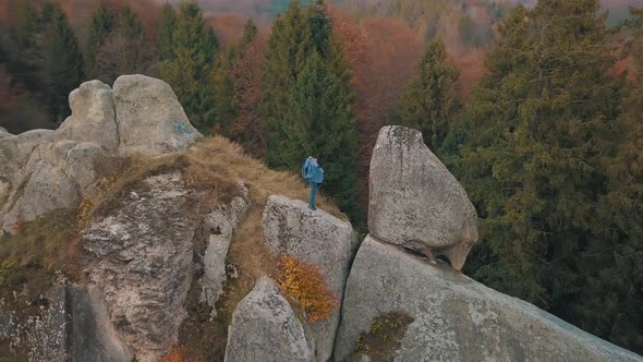 Young Man on the Hill of a Mountain. Businessman. Bridegroom. Groom. Aerial